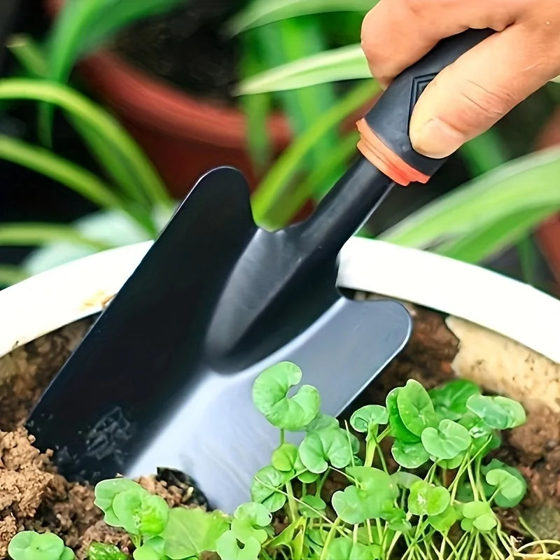 Gardening Tools Including a Small Shovel for Planting Flowers, a Five-Pronged Rake, a Double-Headed Rake
