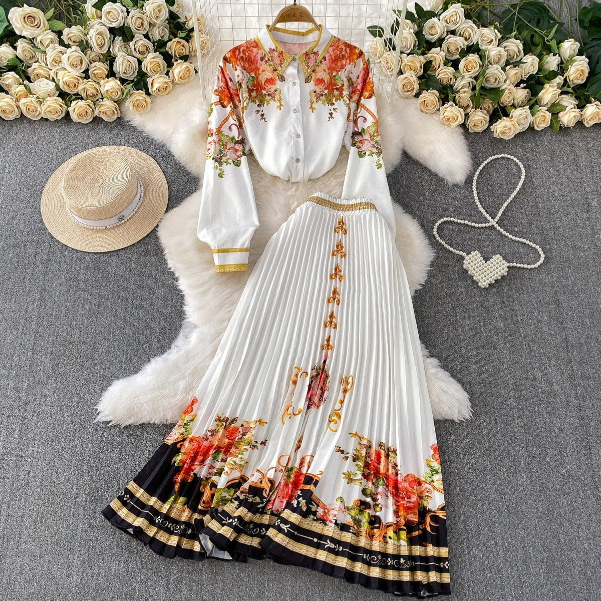European and American retro-style printed single-breasted collared long-sleeved shirt set with high-waisted slimming pleated skirt.