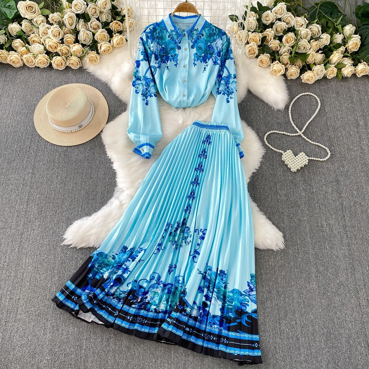 European and American retro-style printed single-breasted collared long-sleeved shirt set with high-waisted slimming pleated skirt.