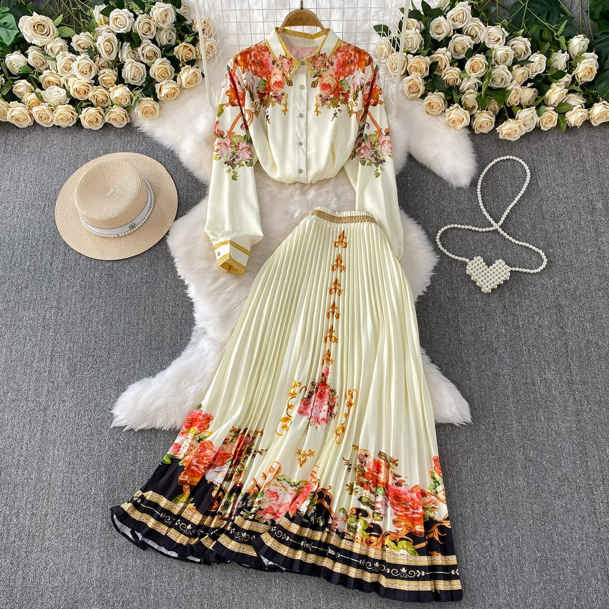 European and American retro-style printed single-breasted collared long-sleeved shirt set with high-waisted slimming pleated skirt.