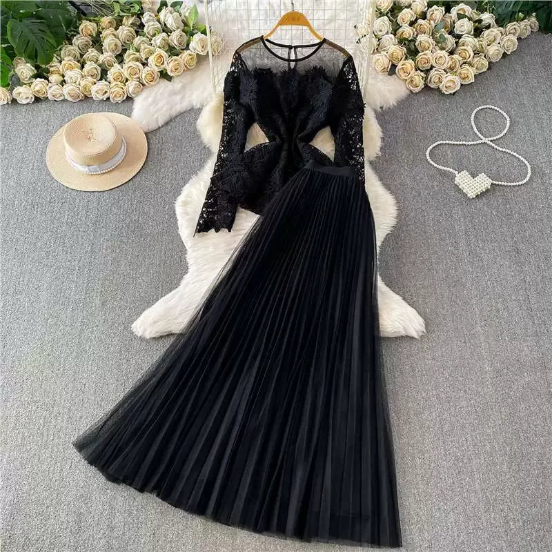 A luxurious, flowing, fairy-like long tulle dress with a sophisticated openwork lace design and a round neck, long sleeves, and a fitted waist. Two-piece set.