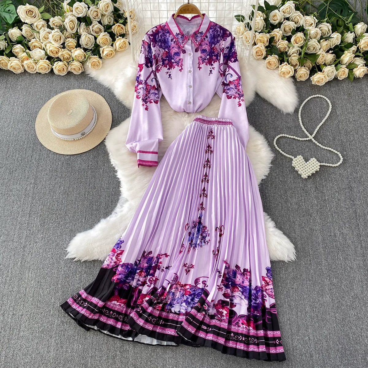 European and American retro-style printed single-breasted collared long-sleeved shirt set with high-waisted slimming pleated skirt.