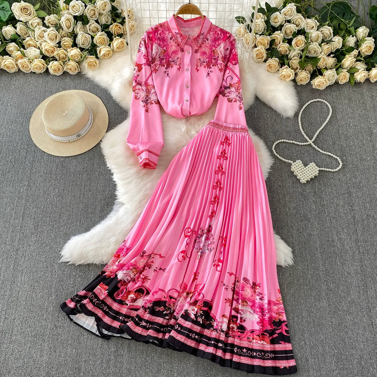 European and American retro-style printed single-breasted collared long-sleeved shirt set with high-waisted slimming pleated skirt.